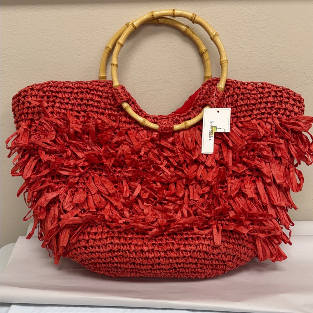 Orange Woven Tote Bag with Bamboo Handles by Straw Studios.